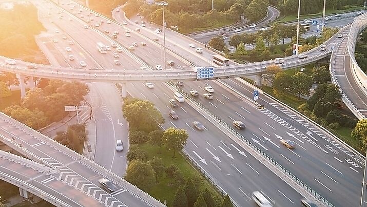 Cars driving on a complicated highway infrastructure with over and under passes