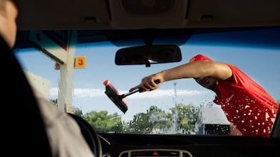 Shell assistant cleaning front screen of the car