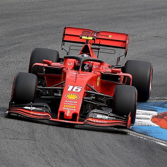 A sleek Ferrari sports car representing high-performance driving with Shell Helix.