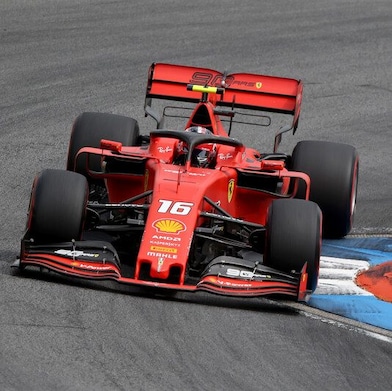 A sleek Ferrari sports car representing high-performance driving with Shell Helix.