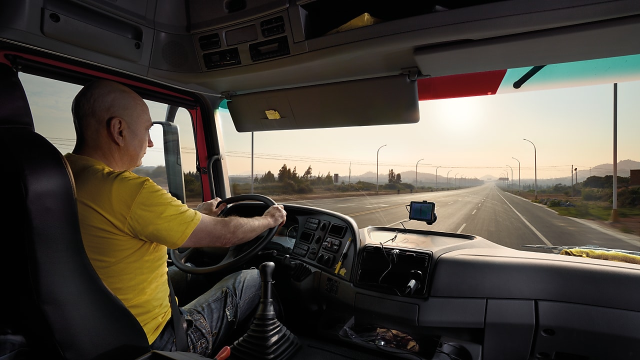 truck driver driving on empty road