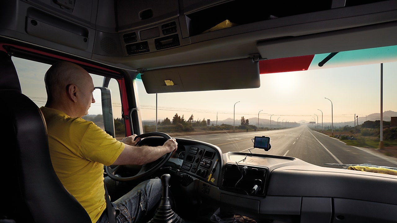 truck driver driving on empty road