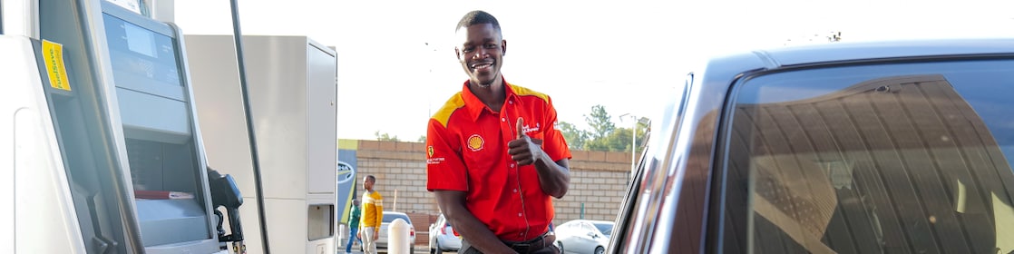 Shell V-Power banner with the slogan 'It's Time to Power Up,' highlighting high-performance fuel.