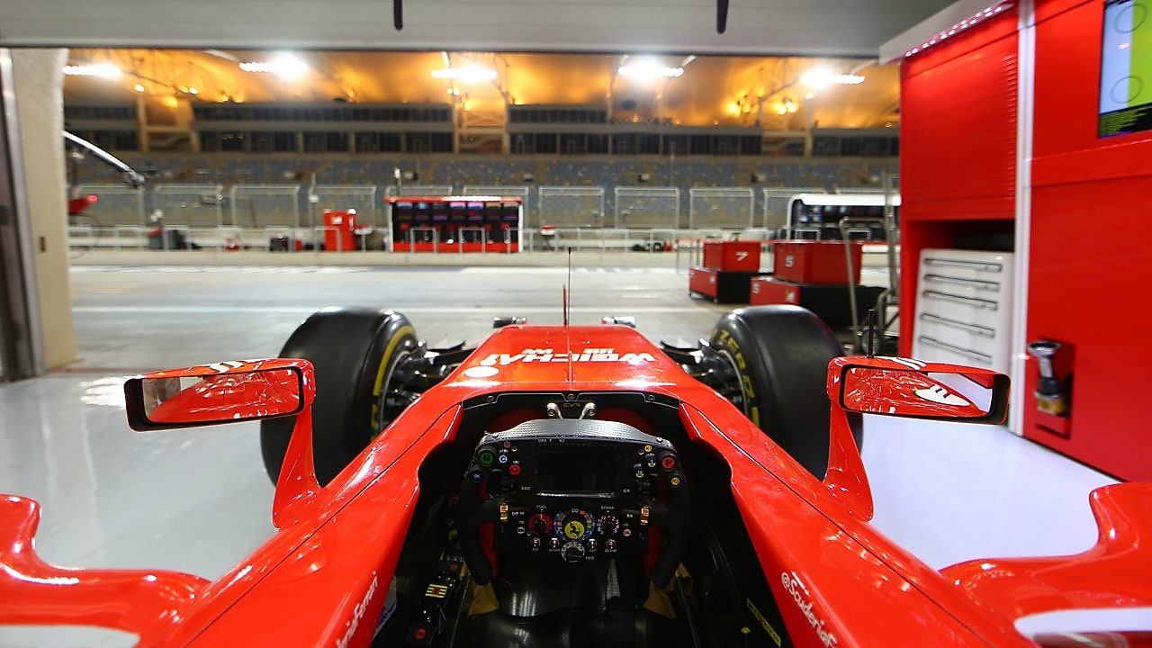 Scuderia Ferrari Formula 1 car in a garage, showcasing Shell’s partnership with Ferrari for high-performance fuels.
