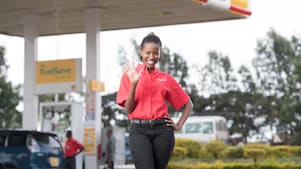 shell kenya forecourt attendant assisting a customer providing quality service and support